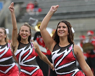 Nikos Frazier | The Vindicator..Gianna Pesce(right), a junior member of the YSU Marching Band, peforms at Stambaugh Stadium before YSU took on University of South Dakota on Saturday, Oct. 1, 2016.