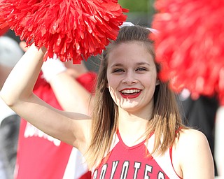 Nikos Frazier | The Vindicator..USD cheerleader, Haley Severson blocks the sun at Stambaugh Stadium in Youngstown on Saturday, Oct. 1, 2016. Youngstown State University would go on to win, 30-20 against University of South Dakota.