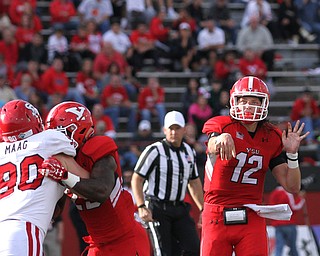 Nikos Frazier | The Vindicator..YSU's Ricky Davis(12) passes in the second quarter at Stambaugh Stadium in Youngstown on Saturday, Oct. 1, 2016. Youngstown State University would go on to win, 30-20 against University of South Dakota.