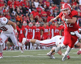 Nikos Frazier | The Vindicator..YSU's Ricky Davis(12) runs the football in the second quarter at Stambaugh Stadium in Youngstown on Saturday, Oct. 1, 2016. Youngstown State University would go on to win, 30-20 against University of South Dakota.