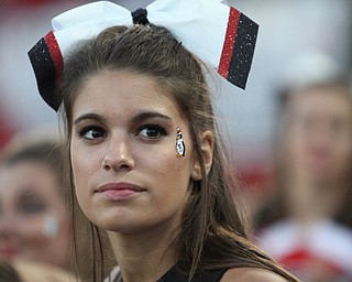 Nikos Frazier | The Vindicator..A YSU cheerleader watches the scoreboard in the final minutes at Stambaugh Stadium in Youngstown on Saturday, Oct. 1, 2016. Youngstown State University would go on to win, 30-20 against University of South Dakota.