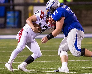 MICHAEL G TAYLOR | THE VINDICATOR- 9-30-16- 2nd qtr., Hubbard's #73 Andrew Cimmento sacks  Niles' qb #13 Tyler Srbinovich. Niles Red Dragons vs Hubbard Eagles at Alumni Field in Memorial Stadium in Hubbard, OH.