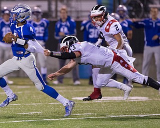 MICHAEL G TAYLOR | THE VINDICATOR- 9-30-16- 2nd qtr., Hubbard's #4 Davion Daniels is stooped from scorng a TD by Niles' #13 Tyler Srbinovich. Niles Red Dragons vs Hubbard Eagles at Alumni Field in Memorial Stadium in Hubbard, OH.