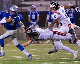 MICHAEL G TAYLOR | THE VINDICATOR- 9-30-16- 2nd qtr., Hubbard's #4 Davion Daniels is stooped from scorng a TD by Niles' #13 Tyler Srbinovich. Niles Red Dragons vs Hubbard Eagles at Alumni Field in Memorial Stadium in Hubbard, OH.