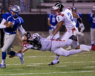 MICHAEL G TAYLOR | THE VINDICATOR- 9-30-16- 2nd qtr., Hubbard's #4 Davion Daniels is stooped from scorng a TD by Niles' #13 Tyler Srbinovich. Niles Red Dragons vs Hubbard Eagles at Alumni Field in Memorial Stadium in Hubbard, OH.