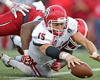 YOUNGSTOWN, OHIO - OCTOBER 1, 2016: Quarterback Chris Streveler #15 of South Dakota reaches for the football to recover his fumble after losing the ball on a hit by Savon Smith #52 of YSU during the second half of their game Saturday afternoon at Stambaugh Stadium. YSU won 30-20. DAVID DERMER | THE VINDICATOR