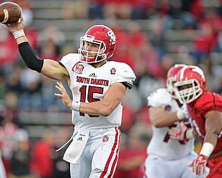 YOUNGSTOWN, OHIO - OCTOBER 1, 2016: Quarterback Chris Streveler #15 of South Dakota throws a pass from the pocket during the second half of their game Saturday afternoon at Stambaugh Stadium. YSU won 30-20. DAVID DERMER | THE VINDICATOR