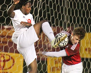 William D. Lewis The Vindicator Mooney's Ken Bledsoe(19), left, and Fitch's Vince Myers(9) go for the ball during 1rst period action Oct. 4, 2016 at Simon Soccer Park in Struthers.