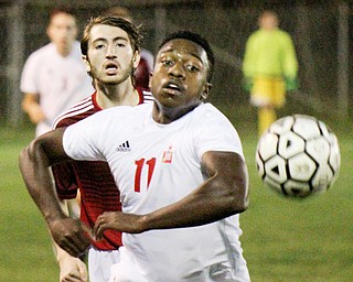 William D. Lewis The Vindicator Mooney's Justin Parkins(11) and ), left, and Fitch's Derian Mesaros(7) go for the ball during 1rst period action Oct. 4, 2016 at Simon Soccer Park in Struthers.