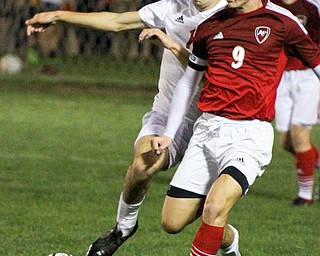 William D. Lewis The Vindicator Mooney's Nate Jones(1), left, and Fitch's Vince Myers(9) go for the ball during 1rst period action Oct. 4, 2016 at Simon Soccer Park in Struthers.
