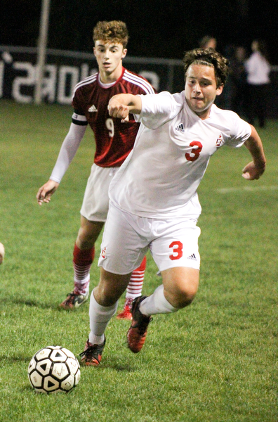 William D. Lewis The Vindicator Mooney's Paul Graziano(3) and Fitch's Vince Myers(9) go for the ball during 1rst period action Oct. 4, 2016 at Simon Soccer Park in Struthers.