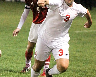 William D. Lewis The Vindicator Mooney's Paul Graziano(3) and Fitch's Vince Myers(9) go for the ball during 1rst period action Oct. 4, 2016 at Simon Soccer Park in Struthers.