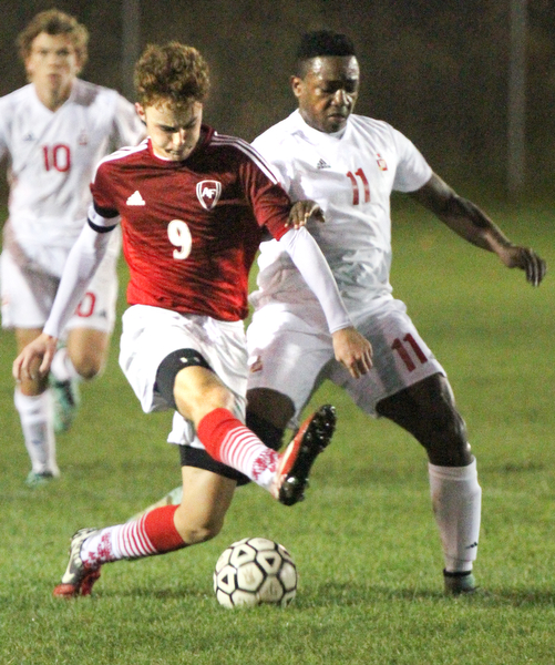 William D. Lewis The Vindicator Mooney's KJustin Parkins(11), left, and Fitch's Vince Myers(9) go for the ball during 1rst period action Oct. 4, 2016 at Simon Soccer Park in Struthers.