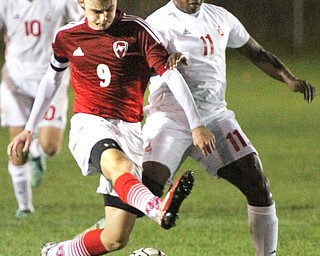 William D. Lewis The Vindicator Mooney's KJustin Parkins(11), left, and Fitch's Vince Myers(9) go for the ball during 1rst period action Oct. 4, 2016 at Simon Soccer Park in Struthers.