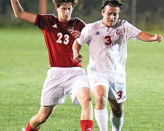 William D. Lewis The Vindicator Mooney's Paul Graziano(3), left, and Fitch'sZack Glavic(23) go for the ball during 1rst period action Oct. 4, 2016 at Simon Soccer Park in Struthers.