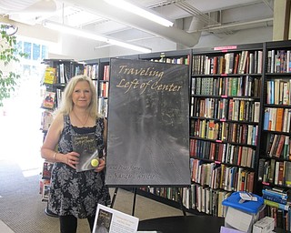 Neighbors | Alexis Bartolomucci.Author, Nancy Christie, held her book and stood next to her book poster at the Poland library on Sept. 10 for a book signing and fundraiser event.