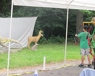 Neighbors | Alexis Bartolomucci.Children had the opportunity to practice archery at the Family Fun Day at Boardman Park on Sept. 17 with the help of people who are trained in archery.