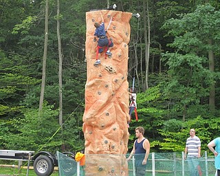 Neighbors | Alexis Bartolomucci.Children lined up to climb the rock wall at Boardman Park for the Family Fun Day event on Sept. 17.