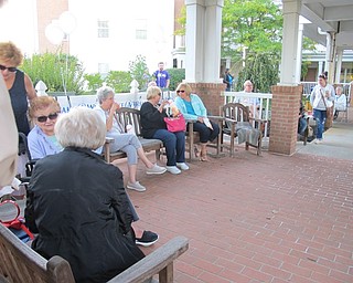 Neighbors | Alexis Bartolomucci.Guests sat under and around the gazebo at the Commons at Greenbriar to enjoy music and refreshments at the benefit concert on Sept. 15.
