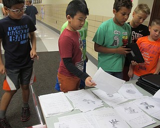 Neighbors | Alexis Bartolomucci.Fourth-grade students at Robinwood Lane Elementary chose a Pokemon character to find using directions their fellow classmates created.