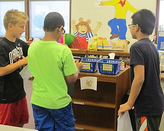 Neighbors | Alexis Bartolomucci.'Robinwood Lane Elementary School fourth-grade students found a Pokemon and took a picture like they were capturing it for a project on Sept. 16.