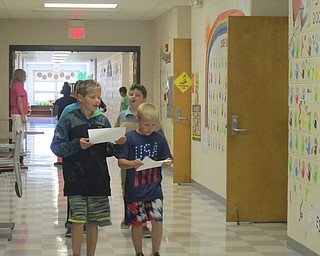 Neighbors | Alexis Bartolomucci.Students walked the halls of Robinwood Lane Elementary on Sept. 16 to try and find hidden Pokemon throughout the bulding using directions their classmates made.