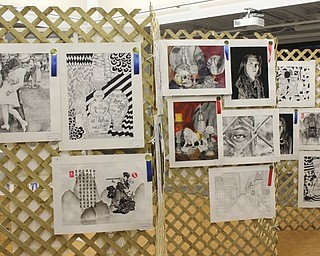 Neighbors | Abby Slanker.Several pieces of Canfield High School art students’ work were on display at the Canfield library through a partnership with the school and the library on Sept. 22.
