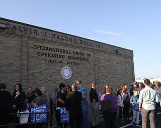 Nikos Frazier | The Vindicator..Breakfast goers wait outside the Western Reseve Building Trade Hall on McClurg Road in Youngstown before Former President Bill Clinton spoke at a breakfast event.