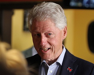 Nikos Frazier | The Vindicator..Former President Bill Clinton speaks with members of the media at Joe Maxx Coffee Company in downtown Youngstown.