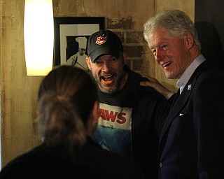 Nikos Frazier | The Vindicator..Former President Bill Clinton greets supporters at Vernon's Cafe in Niles during a stop on a bus tour of the Mahoning Valley.
