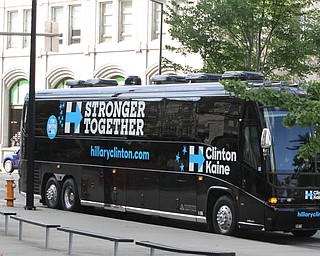 Nikos Frazier | The Vindicator..Former President Bill Clinton arrives in downtown Youngstown to make a surprise stop at Joe Maxx Coffee Company and Starting Lineup Barber shop during a surprise stop during his bus tour of the Mahoning Valley.