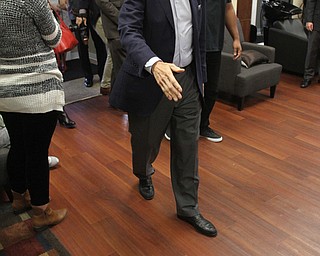 Nikos Frazier | The Vindicator..Former President Bill Clinton walks into Starting Lineup Barber shop in downtown Youngstown during a surprise stop during his bus tour of the Mahoning Valley.