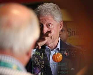 Nikos Frazier | The Vindicator..Former President Bill Clinton speaks with members of the media at Joe Maxx Coffee Company in downtown Youngstown.