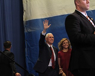 Nikos Frazier | The Vindicator..Gov. Mike Pence(R-Indiana) and his daughter, Charlotte(left) walk on stage at the Walter F. Ehrnfelt Recreation and Senior Center in Strongsville, Ohio on Friday, Oct. 7, 2016.