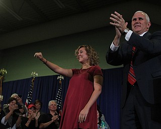 Nikos Frazier | The Vindicator..Gov. Mike Pence(R-Indiana) and his daughter, Charlotte(left) walk on stage at the Walter F. Ehrnfelt Recreation and Senior Center in Strongsville, Ohio on Friday, Oct. 7, 2016.