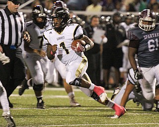 William D. Lewis The Vindicator Harding's Lynn Bowden scampers fopr yardage during Oct. 7, 2016 action in Boardman.