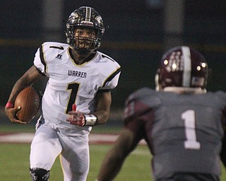 William D. Lewis The Vindicator Harding's Lynn Bowden scampers for 1rst qtr TD during Oct. 7, 2016 action in Boardman. Defending for the Spartans is Koby Adu-Poku (1).
