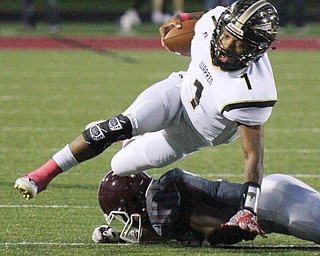 William D. Lewis The Vindicator Harding's Lynn Bowden scampers for yardage during Oct. 7, 2016 action in Boardman. Defending for the Spartans is Koby Adu-Poku (1).