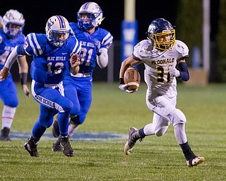 MICHAEL G TAYLOR | THE VINDICATOR- 10-07-16- 1st qtr, McDonald's #31 Alex Cintron takes off on a long run as  Reserve's #13 Wyatt Larimerchases. McDonald's #31 Alex Cintron was caught at the 5 yard line. McDonald Blue Devils vs Western Reserve Blue Devils at Western Reserve Stadium in Berlin Center, OH.