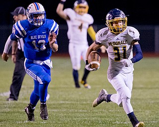 MICHAEL G TAYLOR | THE VINDICATOR- 10-07-16- 1st qtr, McDonald's #31 Alex Cintron takes off on a long run as  Reserve's #13 Wyatt Larimerchases. McDonald's #31 Alex Cintron was caught at the 5 yard line. McDonald Blue Devils vs Western Reserve Blue Devils at Western Reserve Stadium in Berlin Center, OH.