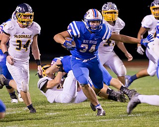 MICHAEL G TAYLOR | THE VINDICATOR- 10-07-16- 2nd qtr, Reserve's #34 Jack Cappabiancal looks fordaylight as McDonald's #34 Dale Wolford chases. McDonald Blue Devils vs Western Reserve Blue Devils at Western Reserve Stadium in Berlin Center, OH.