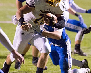 MICHAEL G TAYLOR | THE VINDICATOR- 10-07-16- 1st qtr, McDonald's #28 Mike Zarbaugh rushes for a 5 yard td as Reserve's #6 Joey Clegg tries to make the tackle. McDonald Blue Devils vs Western Reserve Blue Devils at Western Reserve Stadium in Berlin Center, OH.