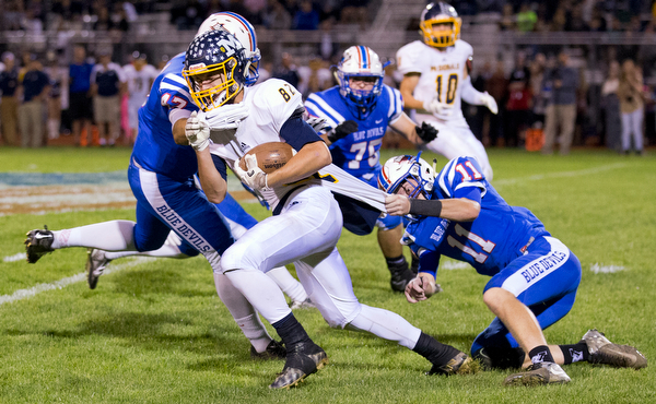 MICHAEL G TAYLOR | THE VINDICATOR- 10-07-16- 2nd qtr, Reserve's #47 Austin Jenkins and #11 Caleb Quinn bring down  McDonald's #82 Joe Sudol after a short return. McDonald Blue Devils vs Western Reserve Blue Devils at Western Reserve Stadium in Berlin Center, OH.