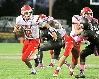 AJ Musolino (18) of Struthers gets a block by Trent Stocker (5) on Campbells Antwane McMeans (3) during the first quarter of Friday nights matchup at Campbell Memorial High School.  Dustin Livesay  |  The Vindicator  10/7/16  Campbell.