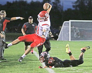 AJ Musolino (18) of Struthers gets hit out of bounds after a long run by Campbell Memorial's Yianni Koullias (11) during the first quarter of Friday nights matchup at Campbell Memorial High School.  Dustin Livesay  |  The Vindicator  10/7/16  Campbell.