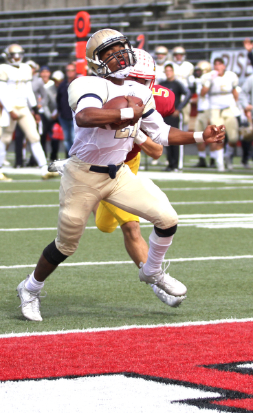 Nikos Frazier | The Vindicator..Canisius' Kenyatta Huston(21) closes in on the final feet towards the Mooney end zone for a touchdown in the first half as Cardinal Mooney took on Canisius High School(Buffalo) at Stambaugh Stadium in Youngstown, Ohio on Sat, Oct. 8, 2016.