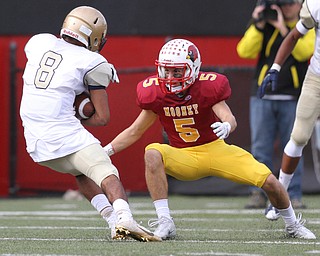 Nikos Frazier | The Vindicator..Mooney's Nico Marchionda(5) prepares to attempt to tackle Canisius' Paul Wood(8) in the second half as Cardinal Mooney took on Canisius High School(Buffalo) at Stambaugh Stadium in Youngstown, Ohio on Sat, Oct. 8, 2016.