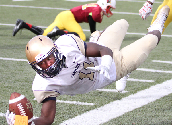 Nikos Frazier | The Vindicator..Canisius' RaeQwon Greer(11) unsuccessfully attempts to get the touchdown as he dives out-of-bounds in the second halfas Cardinal Mooney took on Canisius High School(Buffalo) at Stambaugh Stadium in Youngstown, Ohio on Sat, Oct. 8, 2016.
