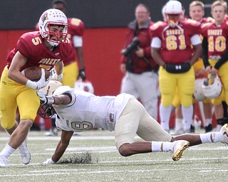 Nikos Frazier | The Vindicator..Mooney's Nico Marchionda(5) is taken down by Canisius' Paul Wood(8) in the second half as Cardinal Mooney took on Canisius High School(Buffalo) at Stambaugh Stadium in Youngstown, Ohio on Sat, Oct. 8, 2016.