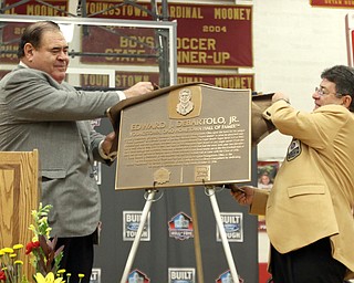        ROBERT K. YOSAY  | THE VINDICATOR..Mr D and Dave Baker  President of the HOF....uncover the placque. at the Eddie DeBartolo HOF plaque unveiling at Cardinal Mooney High School....... - -30-